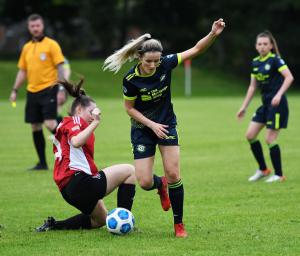 Sion Swifts Ladies forward Tara O'Connor skips past a Maiden City defender.