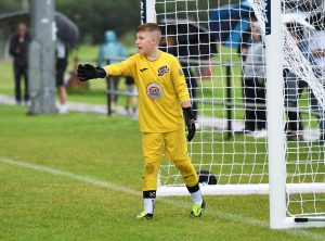 This young keeper points his team-mates in the right direction at Judges Road.