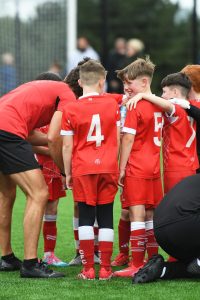 These young Cliftonville under-8's enjoy a half time break at Lisneal College.