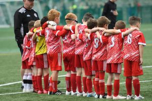 These young Cappry Rovers players share a moment of togetherness.