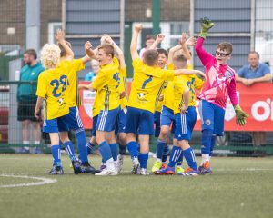 A-spirited-team-huddle-as-Moyola-Park-AFC-gear-up-for-their-Foyle-Cup-Under-10s-group-clash-with-Sion-Swifts-FC-at-Leafair-Derry.-Photos-Roisin-McFadden