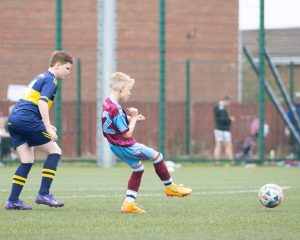 Players-get-underway-at-the-kick-off-during-Thursdays-Foyle-Cup-Under-10s-group-game-between-Don-Boscos-FC-and-Tummery-Athletic-FC-at-Leafair-Derry-Photos-Roisin-McFadden